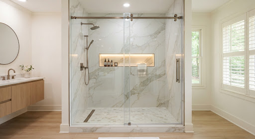 Walk-in shower with glass door and wall niche
