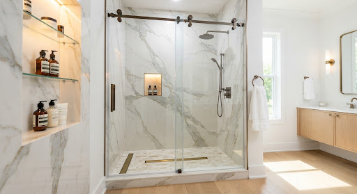 Modern walk-in shower with glass enclosure and bench